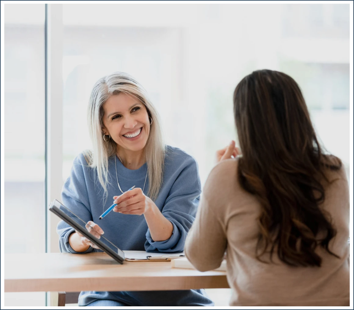 Women talking at a table